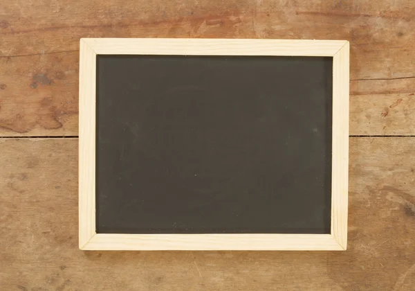 Blackboard på trä bakgrund — Stockfoto