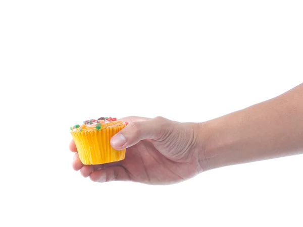 Hand som håller frukt cupcake Stockbild
