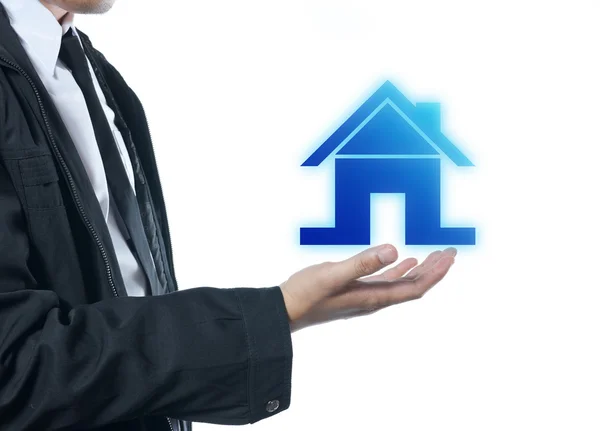 Businessman holding house icon — Stock Photo, Image