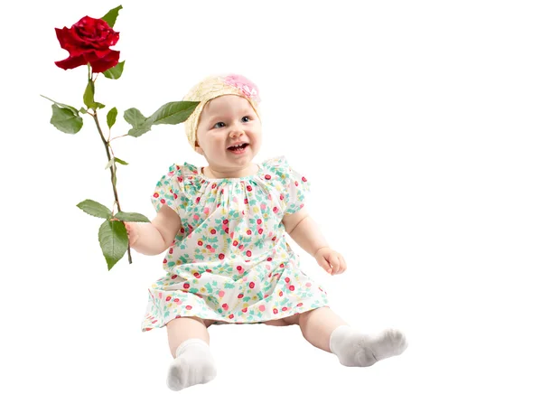 Malé roztomilé dítě dívka s květinou — Stock fotografie