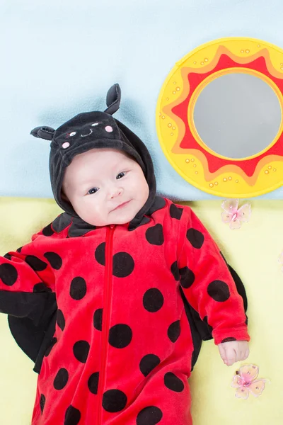 Baby girl in ladybug costume — Stock Photo, Image