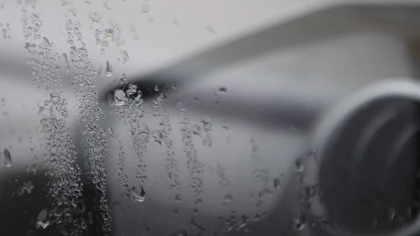 Raindrops on misted glass of car window — Stock Photo, Image