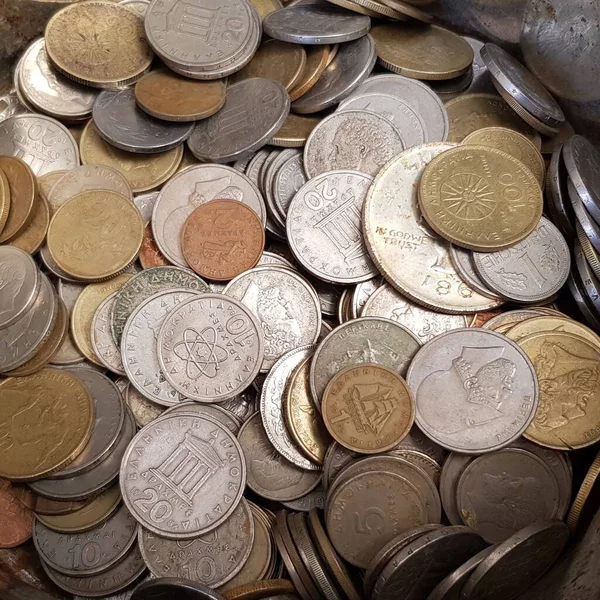 Heap of obsolete Greek coins called drachma