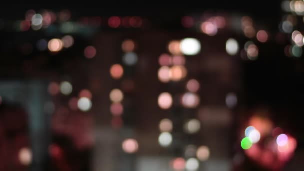 Filmhintergrund von Bokeh blinkenden Stadtlichtern in der Nacht — Stockvideo