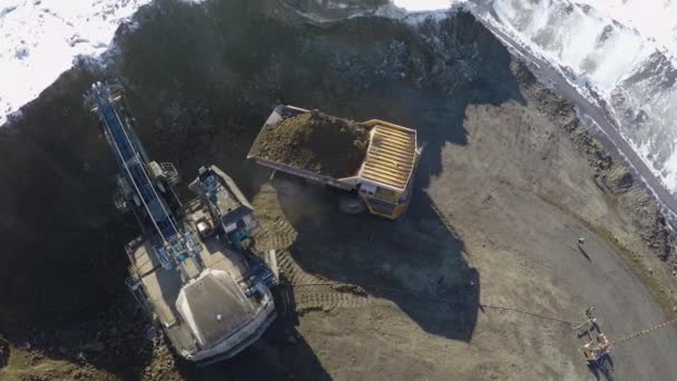 Aerial view of huge quarry trucks — Stock Video