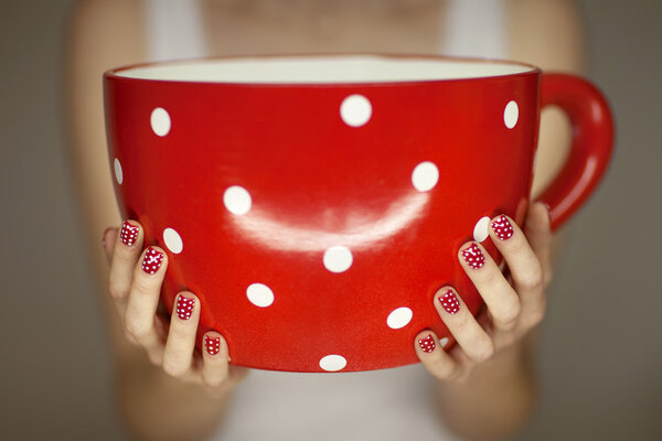 woman hands holding giant coffee cup