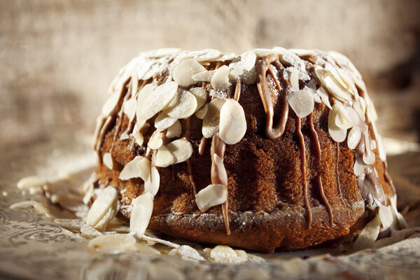 Delicious cake with chocolate and almonds