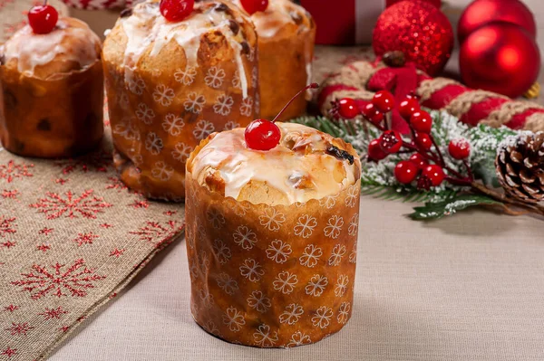 Delicious Christmas dessert, homemade mini panettone with fruits, nuts