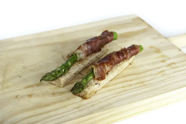 Asparagus with ham — Stock Photo, Image