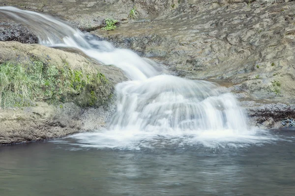 Waterfall, silk effect. waterfall in autumn Royalty Free Stock Photos