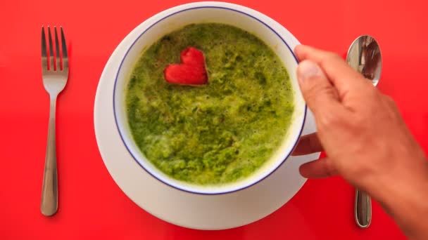 Soup with heart shaped carrot — Stock Video