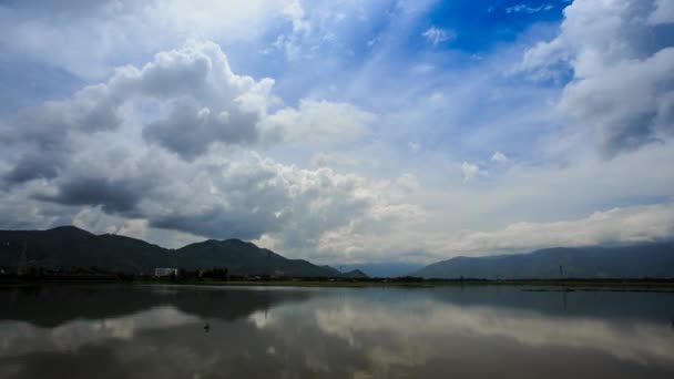 Cumulus clouds reflected in river — Stock Video