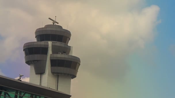 Control tower by airport terminal — Stock Video