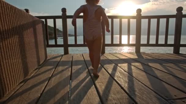 Little girl in beach cafe — Stock Footage Little girl in beach cafe Royalty Free Stock Video