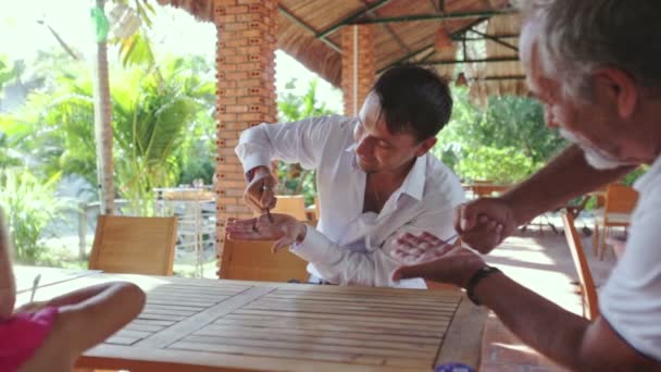 Conjurer Pierces Spoon into Hand — Stock Video