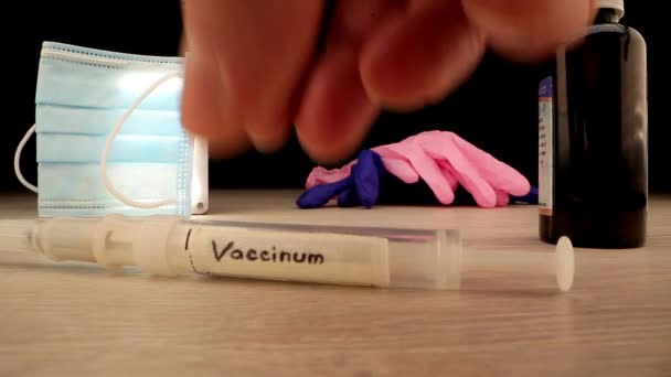 Person takes syringe and puts different coloured pills — Stock Video