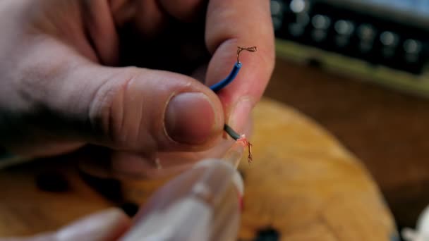 Repairman pours liquid soldering flux on wires closeup — Stock Video