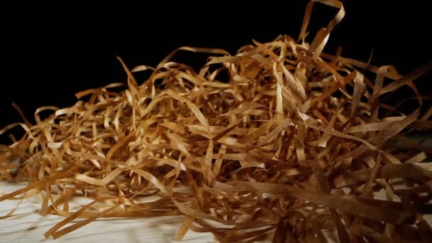 Pile of artificial hay of paper used as filling for parcels — Stock Video
