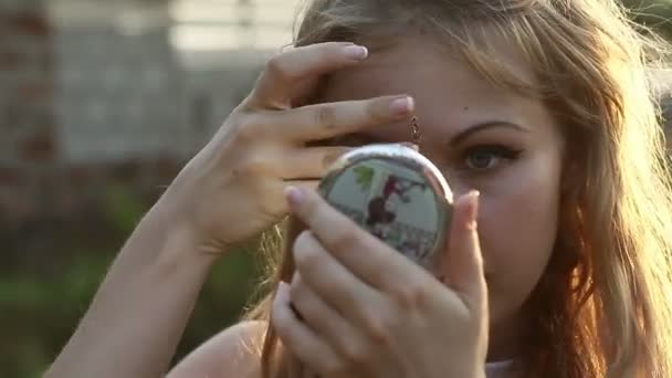 Girl looking in mirror — Stock Video