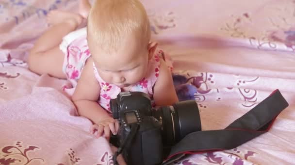 Child in dress lay on  bed — Stock Video