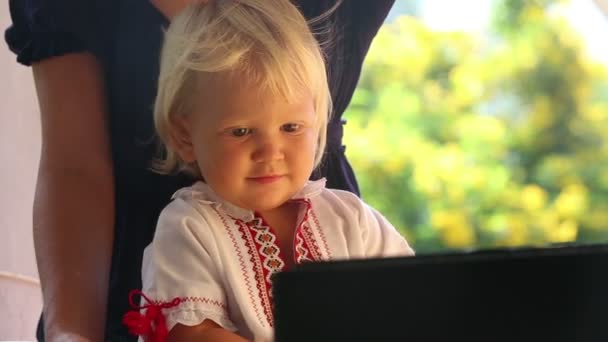 Baby girl watching cartoon — Stock Video © slavastock #64139047