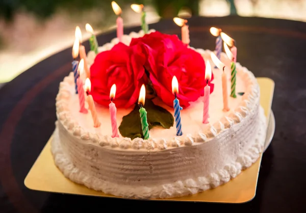 Delicious cake with candles — Stock Photo, Image