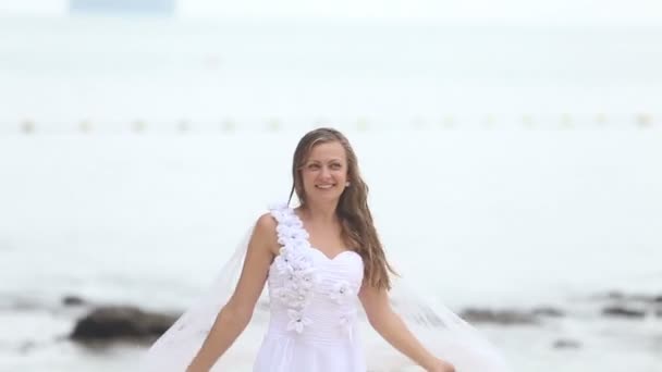 Beautiful bride on beach — Stock Video