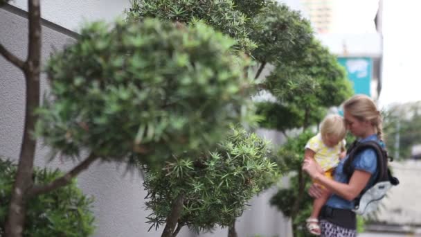 Mother with  daughter   near  bonsai trees — Stock Video