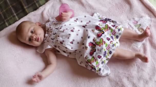 Baby girl  on pink blanket — Stock Video