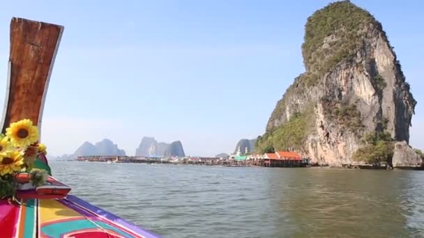 Longtail boat passing cliff — Stock Video
