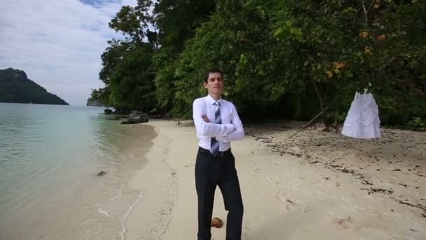 Groom standing on sea beach — Stock Video