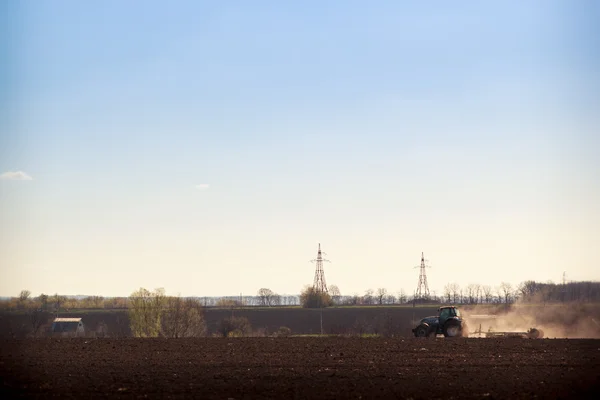 Cultivator raises dust — Stock Photo, Image