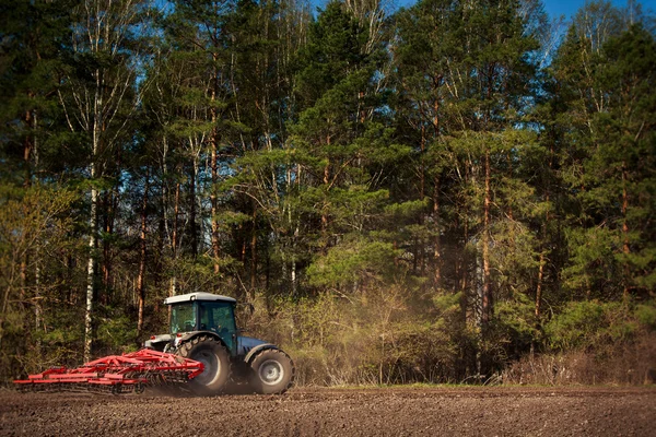 Rural tractor  in spring — Stock Photo, Image