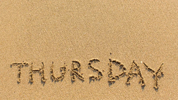 Thursday - word drawn on sand — Stock Photo, Image