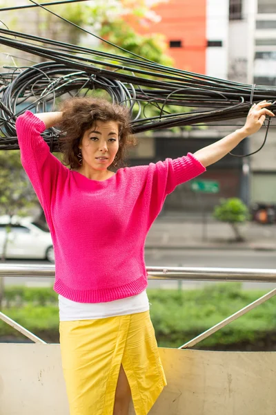 Young asian woman in an urban landscape. — Stock Photo, Image