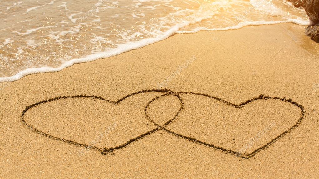 Two Hearts in the sand Stock Photo by ©dimaberkut 106743854