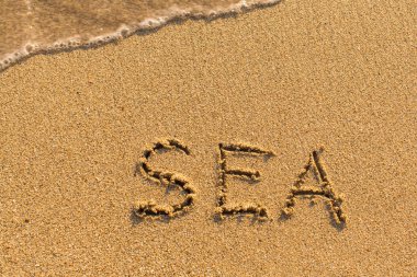 Deniz - el tarafından yazıt 