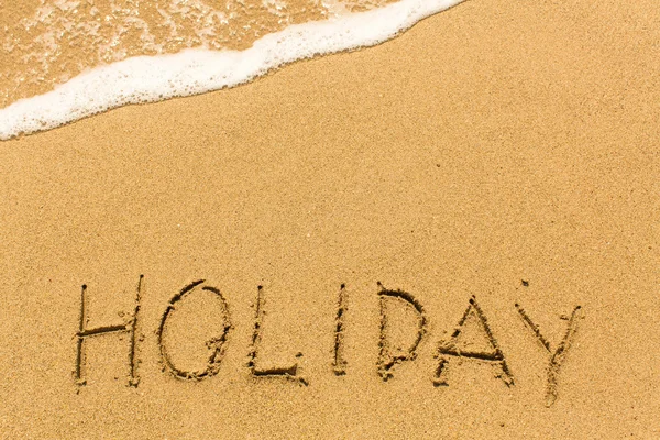 Holiday word på sand — Stockfoto