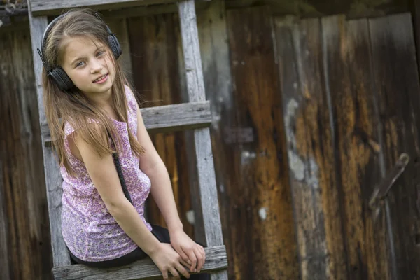 Little girl in headphones — Stock Photo, Image