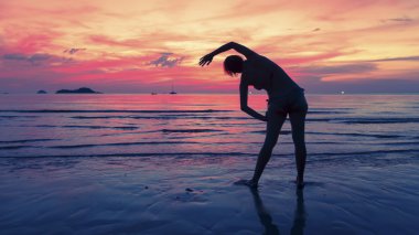Woman performs physical exercises
