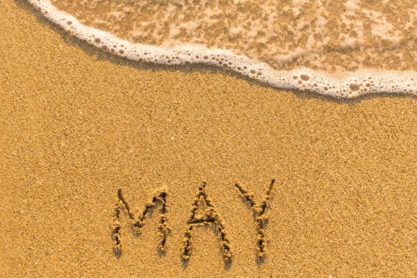 Palavra de maio em areia — Fotografia de Stock