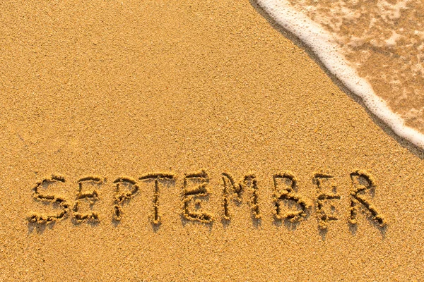 Word september on the sand — Stock Photo, Image