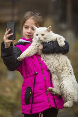 girl takes a selfie with a cat clipart