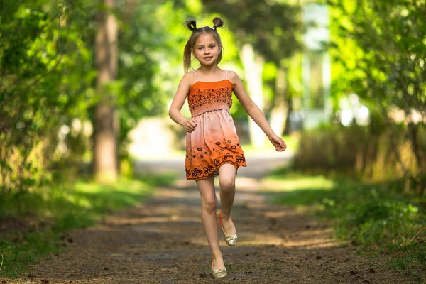 Cheerful little girl running — Stock Photo, Image