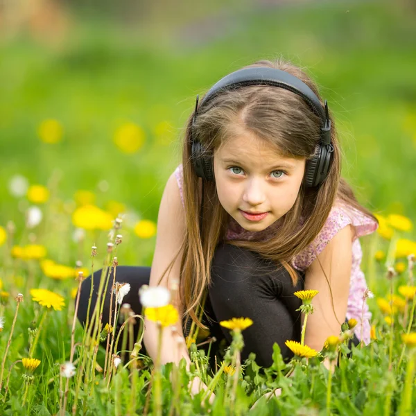 Little girl in headphones — Stock Photo, Image