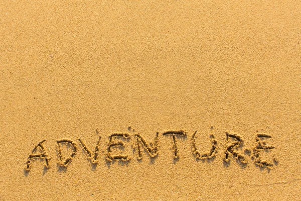 Letras de aventura na praia de areia — Fotografia de Stock