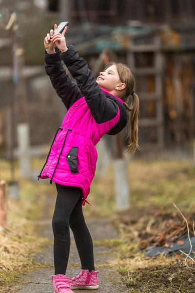 Little girl  makes selfie — Stock Photo, Image