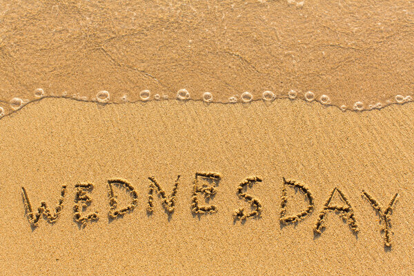 Wednesday - hand-written on the sand