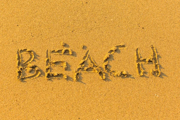 Playa - inscripción en la arena . — Foto de Stock