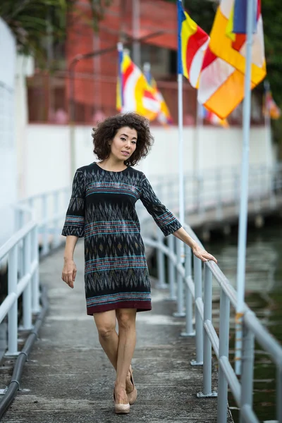 Young asian woman on embankment — Stock Photo, Image